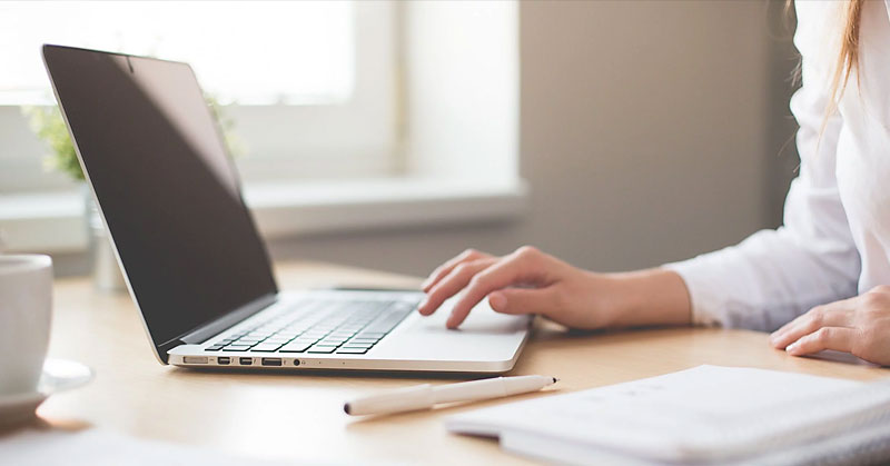 Woman using laptop at work