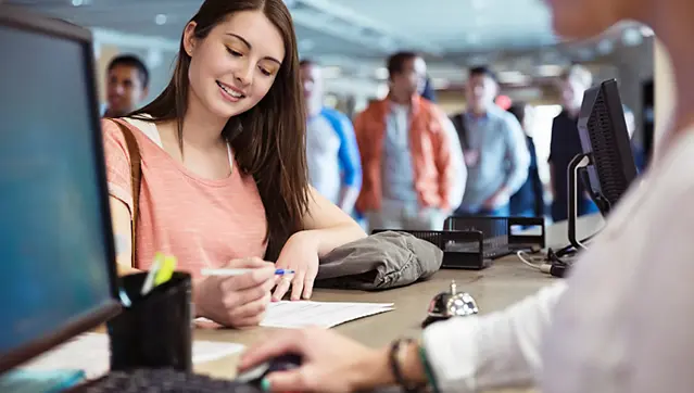 Collage Student At Front Desk Of University